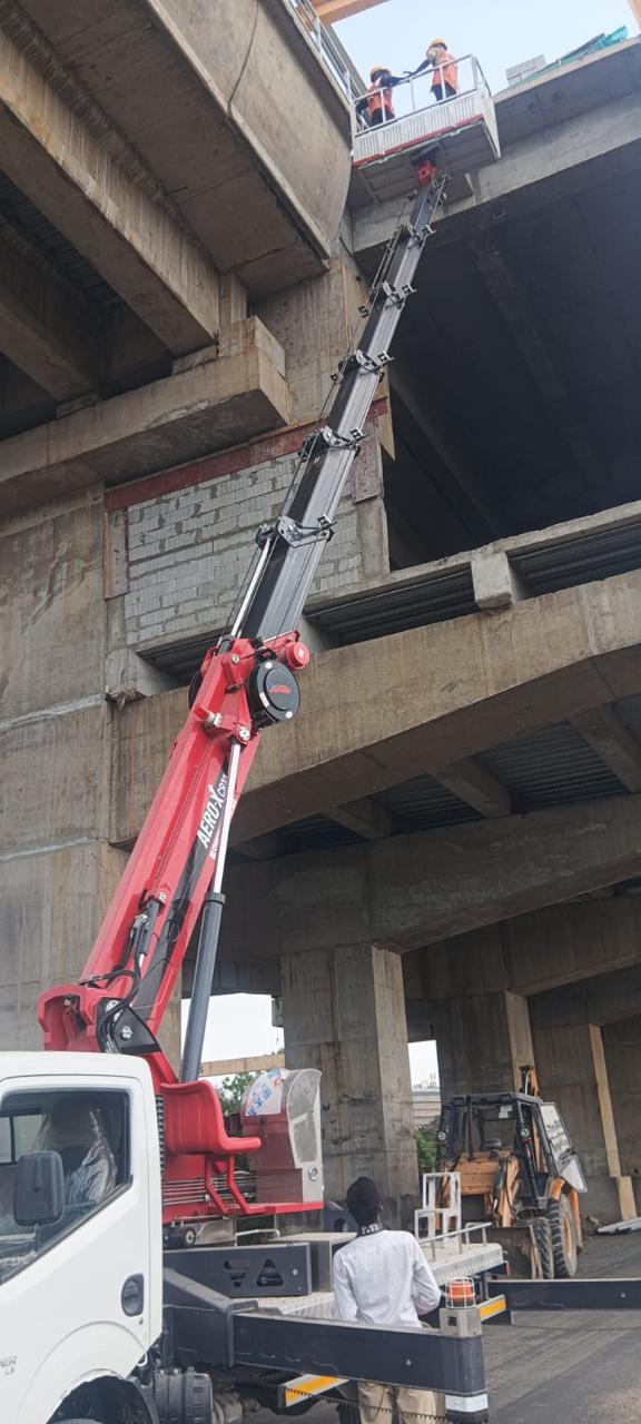 Vidhistutya truck mounted boom lift at Surat Metro viaduct